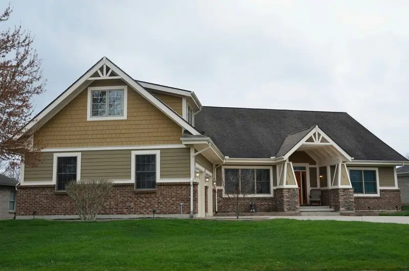 Two-story craftsman home with a green lawn